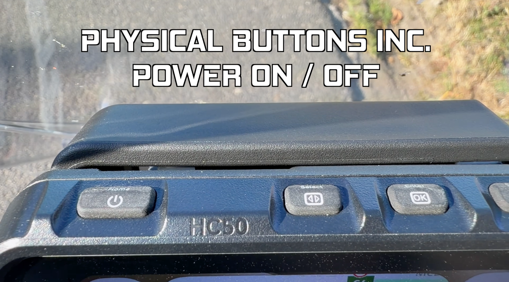 Physical buttons on top of the HFK HC50 RM, including power on/off