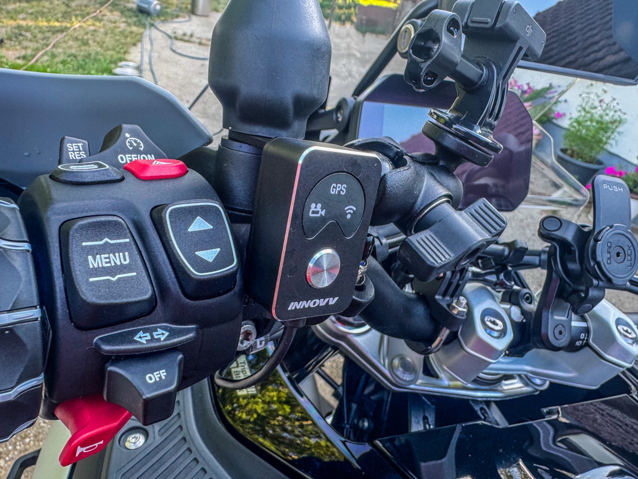 INNOVV K7 handlebar controller fitted beside the BMW controls