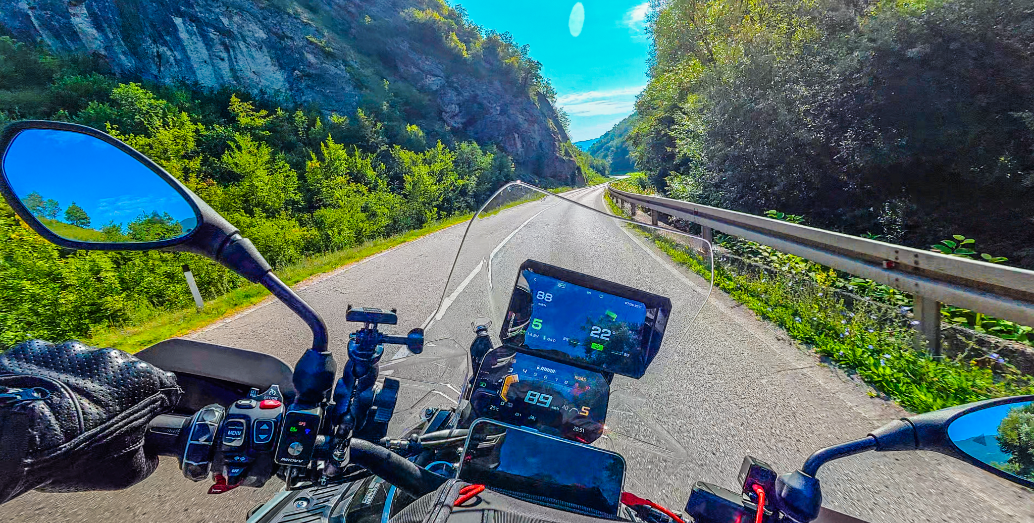 RiderNav R7M lean-angle and bike-data layout in use on a winding road